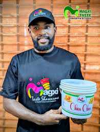 A customer with a bucket of Magxi chin chin