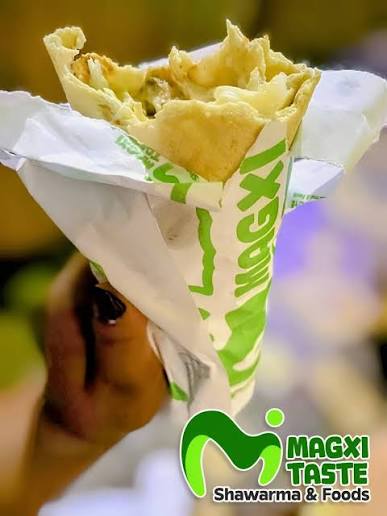 Magxi shawarma in its branded wrapper